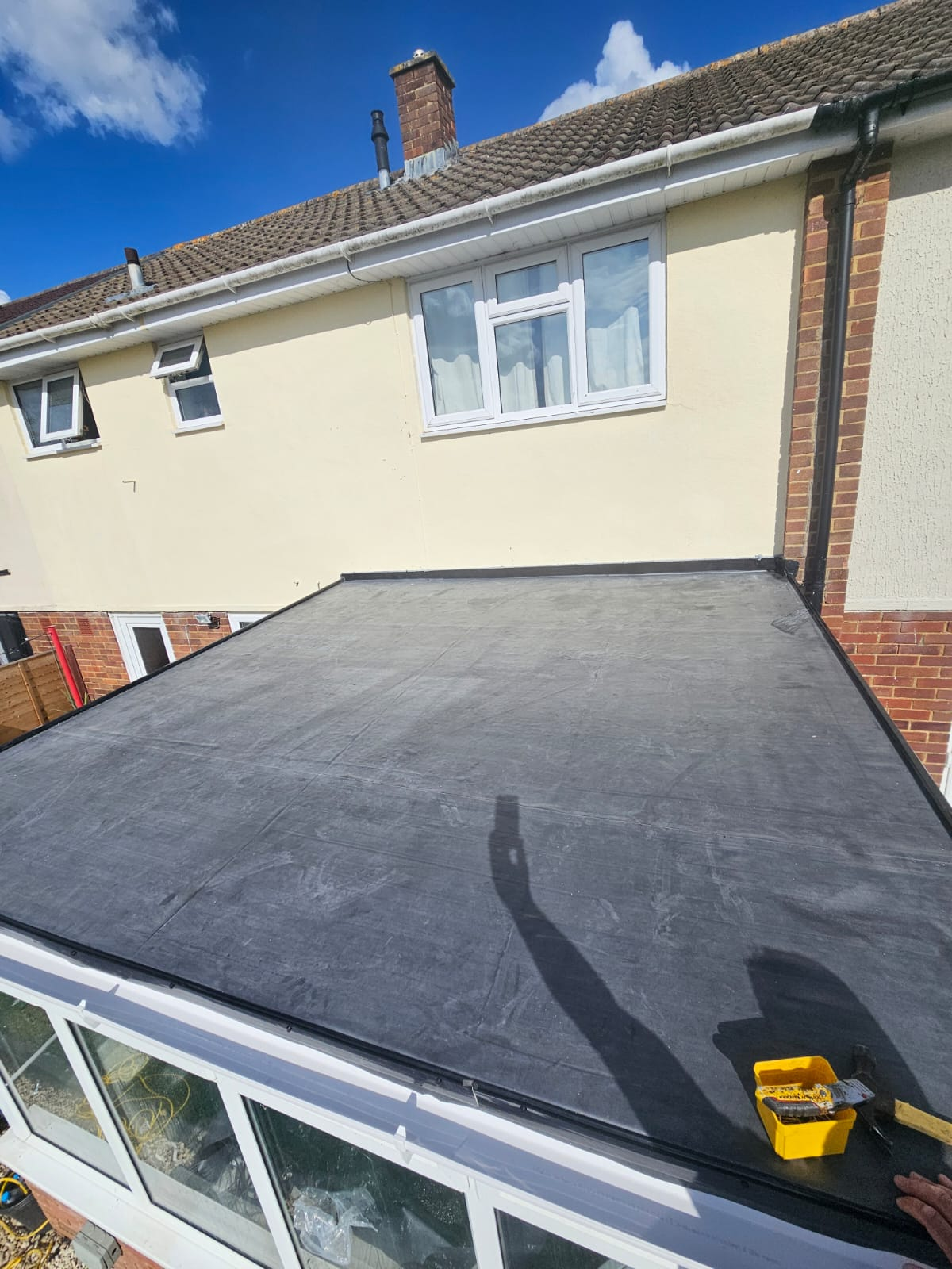Completed EPDM flat roof installation on a conservatory-style extension
