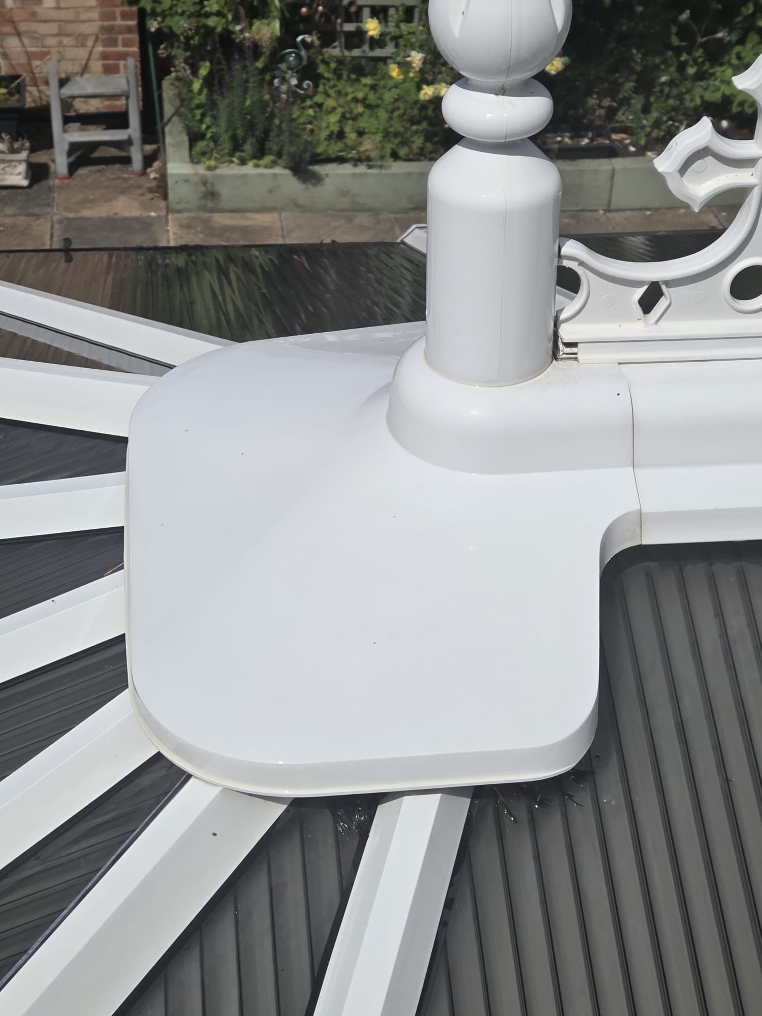 Conservatory ridge finial and decorative cresting before exterior cleaning
